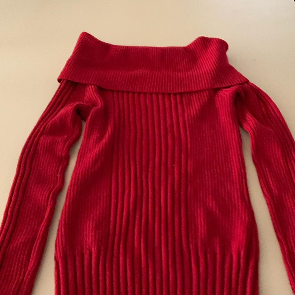 Red sweater, size medium, gently used.